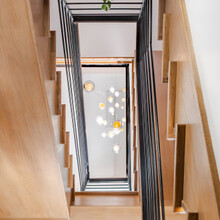 Custom Built Luxury Home in Manchester, VT lookup view of stairwell